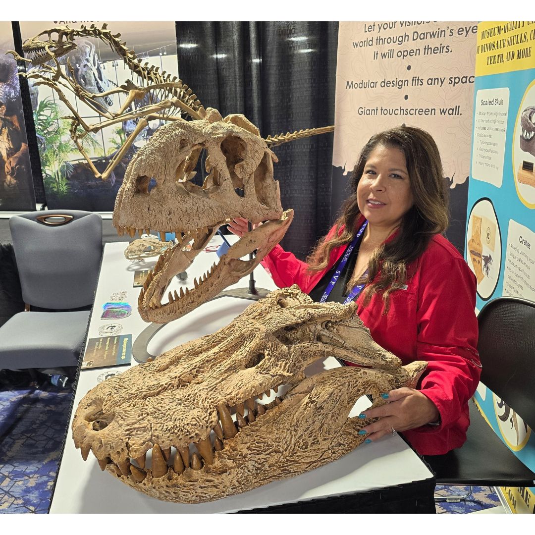 Dr. Lopez with Majungasaurus and Mahajangasuchus Skull Casts