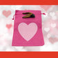 Triceratops tooth cast with Hot Pink Bag/Light Pink Heart gift bag.