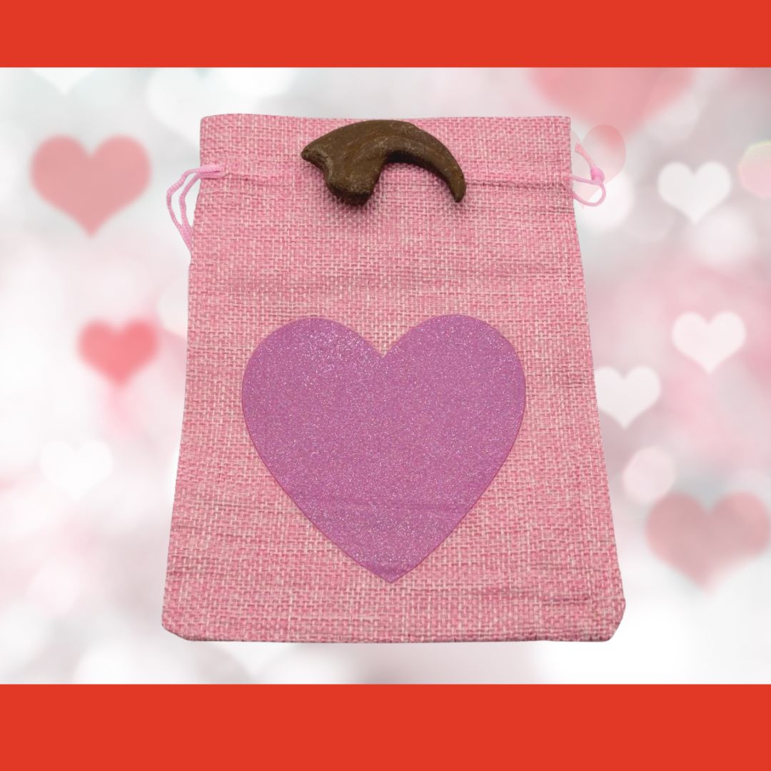 Utahraptor hand claw cast with Light Pink Bag/Dark Pink Heart gift bag.
