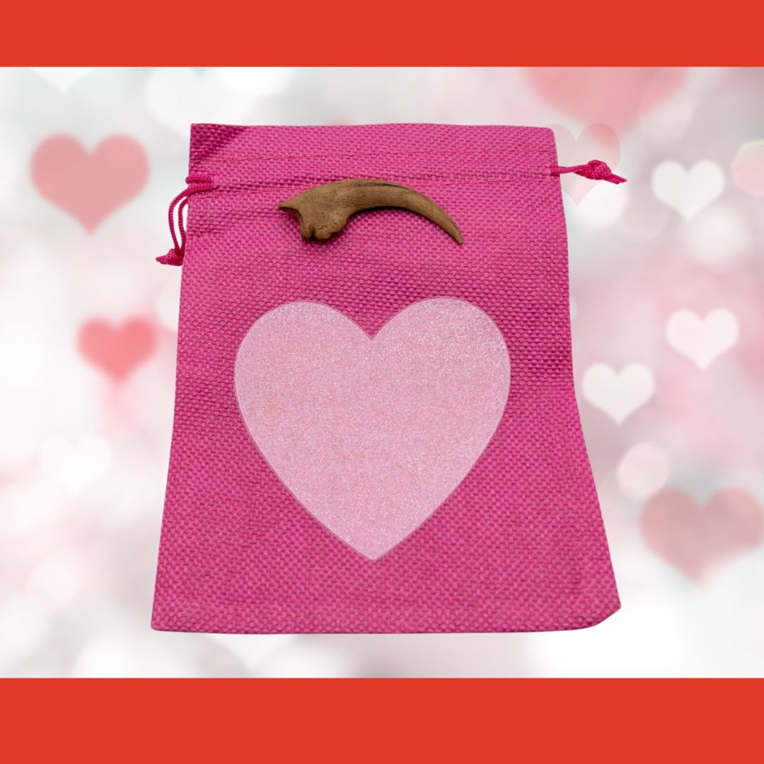 Velociraptor claw cast with Hot Pink Bag/Light Pink Heart gift bag.